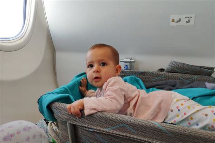 Where should you sit on a plane with a baby?